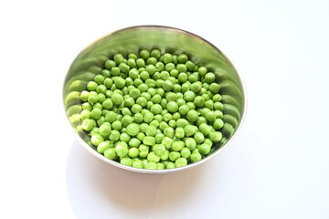 Fresh green pea on white background. There is a lot of vitamins  and Minerals in it. The pea is most commonly the small spherical seed or the seed. Popular vegetable of all over world. 