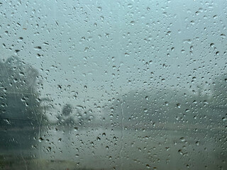 Raindrops on the window. Blue tone