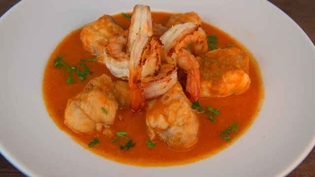 Recipe for Armorican-style monkfish tail, prawns, flambees with cognac, High quality video