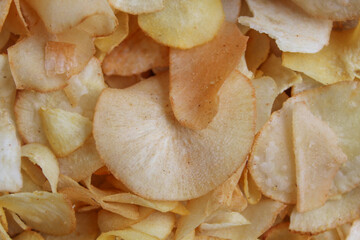 Cassava chips as background, flat lay