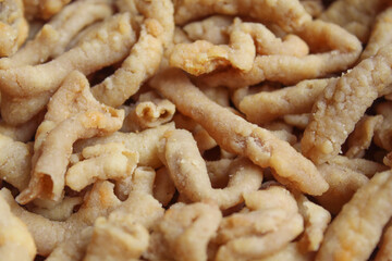 Crispy fried chicken intestines, as background, flat lay or top view