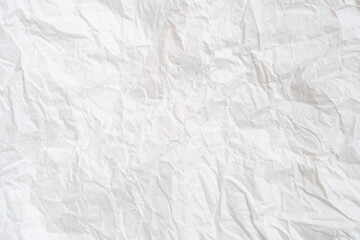 Wrinkled or crumpled white stencil or tissue paper used for crumpled paper background texture..
