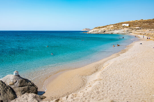 Lia Beach, wild and free beach in the south of Mykonos, Greece. Pristine bay with blue sea and crystal water, famous for naturism and Scuba diving school, peaceful and quiet.