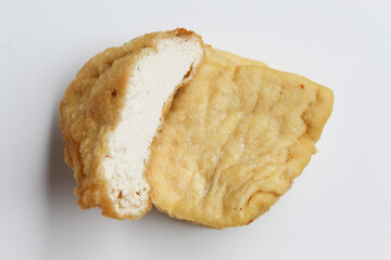 Fried yellow tofu sliced, isolated on white background
