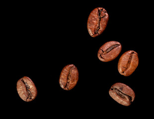 Coffee beans isolated on black background. Close-up