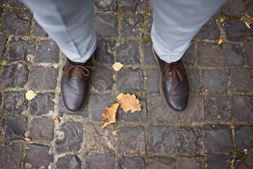 men's shoes, shoes for the groom, boots and trousers, the man stands on the paving slab