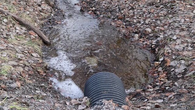 Water drainage pipe. Flowing fast. 