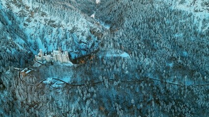 Aerial panorama of royal castle Neuschwanstein in Bavaria, Germany (Deutschland). The famous Bavarian place sign at winter morning.