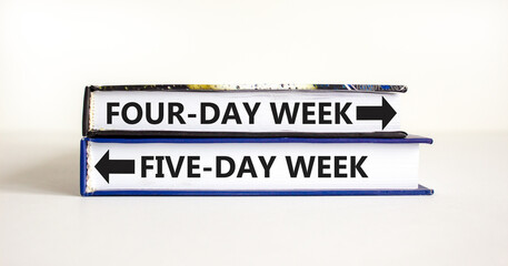 5 or 4 day week symbol. Concept word Five-day week or Four-day week on beautiful books. Beautiful white table white background. Business and five or four day week concept. Copy space.
