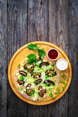 Vietnamese pizza - rice pepper omelet on wooden table