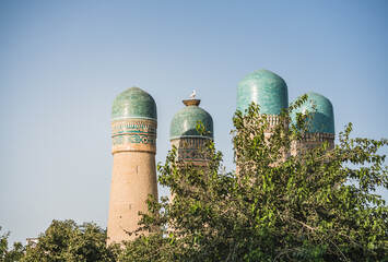 Exterior of Chor Minor Madrasah in the ancient city of Bukhara in Uzbekistan, oriental architecture...