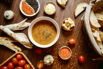 Wooden Table With Assorted Soups and Bread