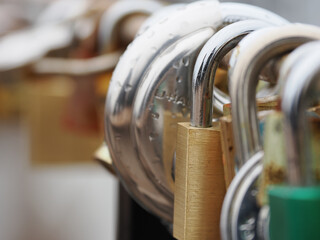 Multiple padlocks attached on to the Brooklyn Bridge.