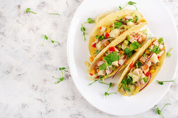 Mexican tacos with chicken meat, corn and salsa. Healthy tacos. Diet menu. Mexican taco. Top view, flat lay