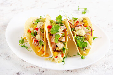 Mexican tacos with chicken meat, corn and salsa. Healthy tacos. Diet menu. Mexican taco.