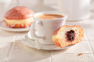 Sweet and hot doughnuts deep frying in oil.