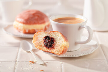 Delicious and fresh doughnuts ready to eat in kitchen.