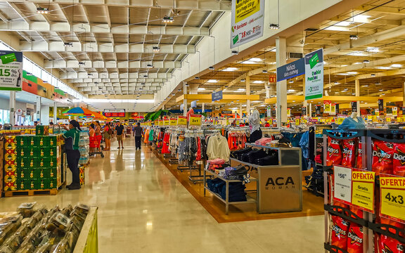 Supermarket from the inside Shelves Goods People Shopping carts Products.