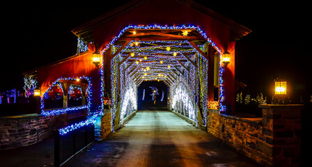 Twinkling Blue And White Lights Line The Interior Of Herr's Mill Covered Bridge From 1844, Creating A Festive Tunnel Effect At Night, With A Sign Displaying The Name And Date. - obrazy, fototapety, plakaty