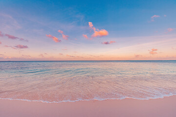 Beachfront sunset. Beautiful panoramic landscape, colorful golden sunlight over calm sea waves...