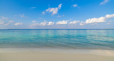 Calm sea and white sand on beach. Minimal summer wallpaper background with copy space....