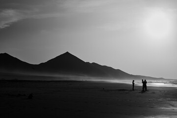 Sunset on Cofete beach in Fuerteventura in Jandia Natural Park with silhouettes and mountains