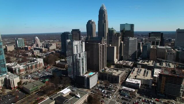 Aerial Panning Shot Of Modern Office Buildings In Residential City Against Clear Sky On Sunny Day - Charlotte, North Carolina