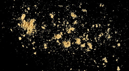 Ginger root powder isolated on black background
