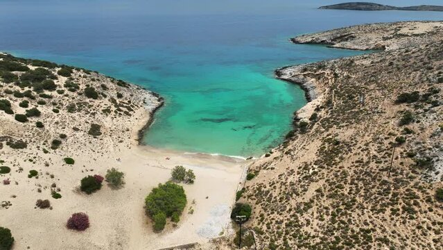 Aerial drone video of paradise secluded beach of Psili Amos in small island of Schoinousa, Small Cyclades, Greece