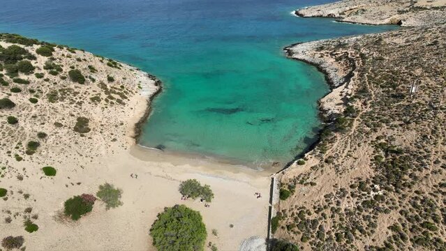 Aerial drone video of paradise secluded beach of Psili Amos in small island of Schoinousa, Small Cyclades, Greece