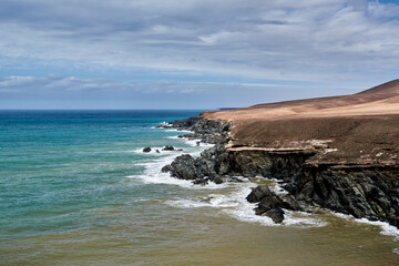 Fototapeta na wymiar Landscape on the coast of the Atlantic Ocean in Fuerteventura, Spain