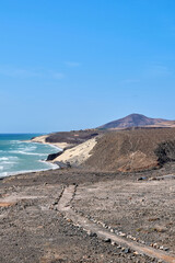 The Atlantic Ocean and Sotavento beach with clear sky and mountains in back
