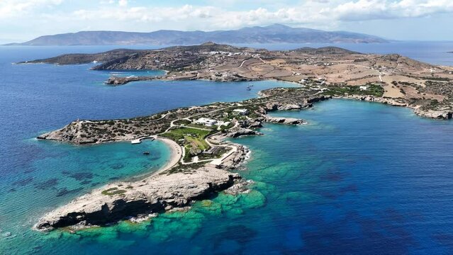 Aerial drone video of paradise secluded beach and bay of Agios Vasileios located in long peninsula of small island of Schoinousa, Small Cyclades, Greece