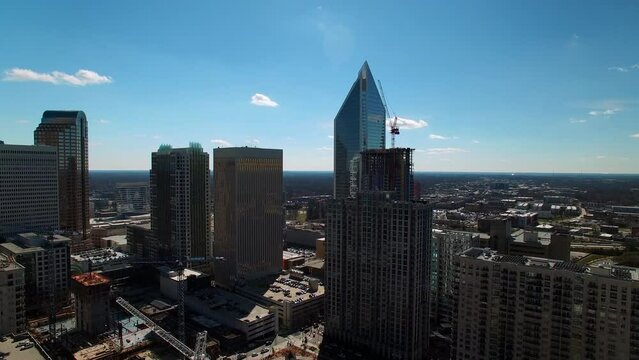 Aerial Shot Of Modern Office Towers In Residential City Against Sky, Drone Flying Forward On Sunny Day - Charlotte, North Carolina