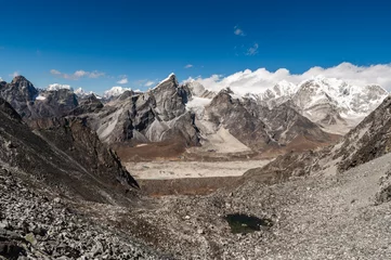Papier Peint photo Cho Oyu Alpine lake, Mounts Lobuche, Cho Oyu and Khumbu Glacier from Kongma La Pass during Everest Base Camp EBC or Three Passes trekking in Khumjung, Nepal. Highest mountains in the world.