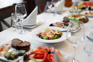 a lot of different food and snacks on the festive table