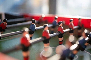 A close-up of the table football game of football figures on the field