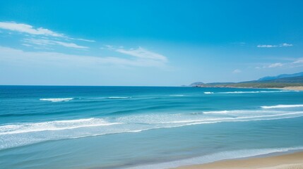 Fototapeta premium landscape of blue sea with white sand and small waves, ideal place to relax