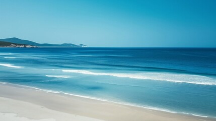 Obraz premium landscape of blue sea with white sand and small waves, ideal place to relax