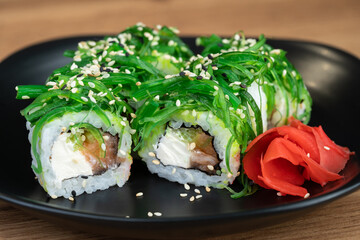 delicious traditional Japanese sushi and rolls on a plate