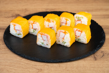 delicious traditional Japanese sushi and rolls on a plate