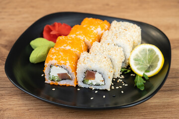 delicious traditional Japanese sushi and rolls on a plate