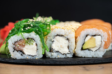 delicious traditional Japanese sushi and rolls on a plate