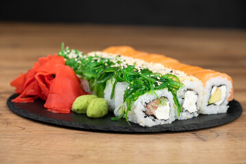 delicious traditional Japanese sushi and rolls on a plate