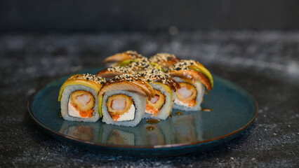 Sushi rolls are served on a plate. soy sauce. Delicious seafood food.