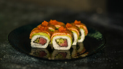Sushi rolls are served on a plate. soy sauce. Delicious seafood food.