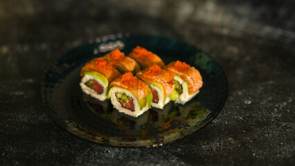 Sushi rolls are served on a plate. soy sauce. Delicious seafood food.