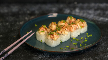 Sushi rolls are served on a plate. soy sauce. Delicious seafood food.