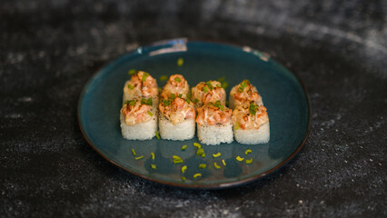 Sushi rolls are served on a plate. soy sauce. Delicious seafood food.