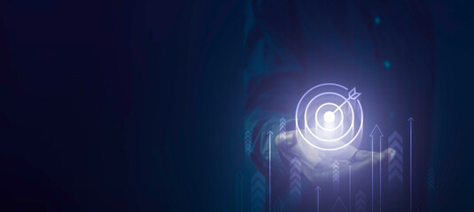 Business growth and goals concept with a holographic target planning investment icon and ascending arrows in a futuristic blue overlay. Development to success and Planning, business strategy.